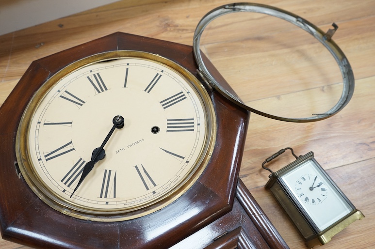 An American Seth Thomas mahogany wall clock and a French carriage timepiece, largest 55cm high. Condition - fair to good, untested